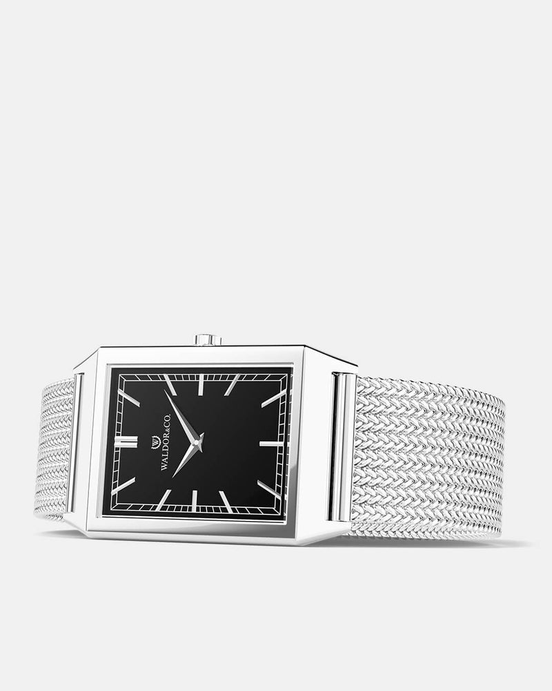 A square mens watch in rhodium-plated silver from Waldor & Co. with black sunray dial. Seiko movement. The model is Conceptual 37 Antibes 29x43mm. 