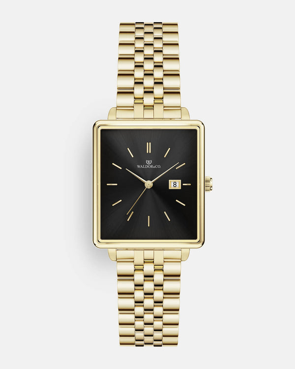 A square womens watch in 14k gold from Waldor & Co. with black sunray dial and a second hand. Seiko movement. The model is Delight 32 Chelsea 28x32mm. 