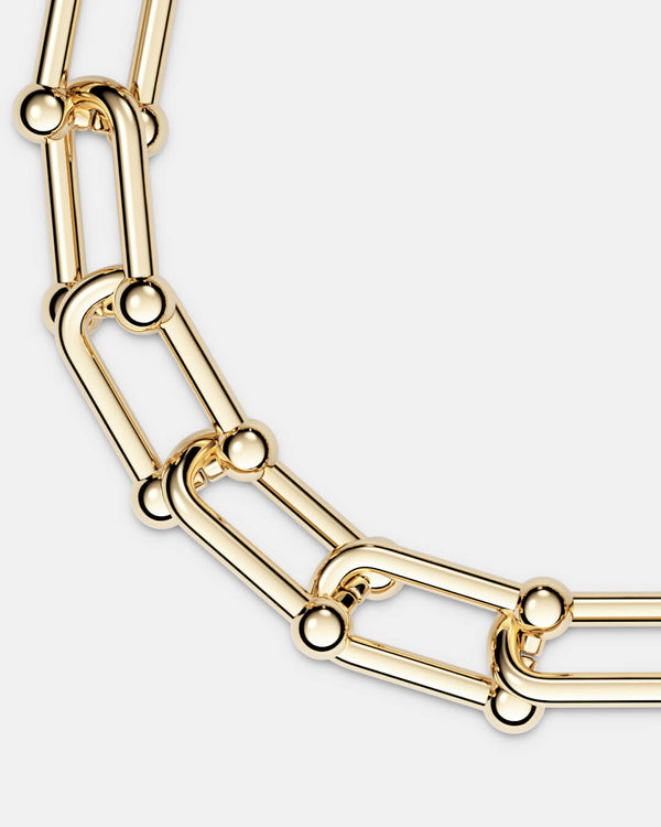 A polished stainless steel chain in 14k gold from Waldor & Co. The model is Pivot Chain Polished. 