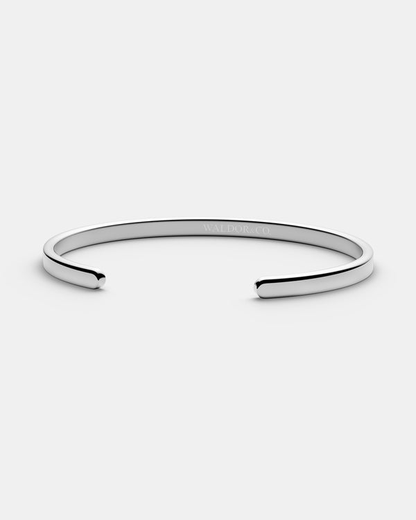 A Square Bangle in 925 Sterling Silver from Waldor & Co. The model is Pure Bangle Sterling Silver