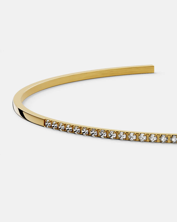A Bangle in 14k gold-plated 316L stainless steel from Waldor & Co. One size. The model is Bliss Bangle Polished.