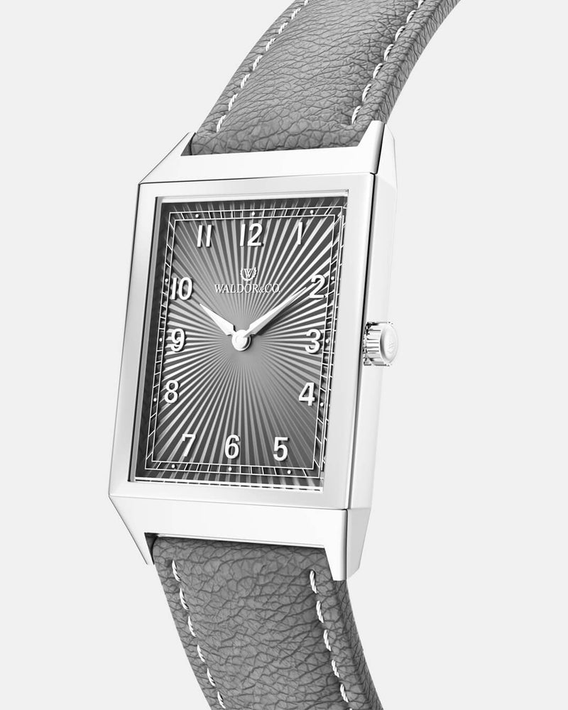 A square mens watch in Rhodium-plated 316L stainless steel from Waldor & Co. with grey guilloche dial. Miyota movement. Leather strap. The model is Conceptual 37 Cap Ferrat.