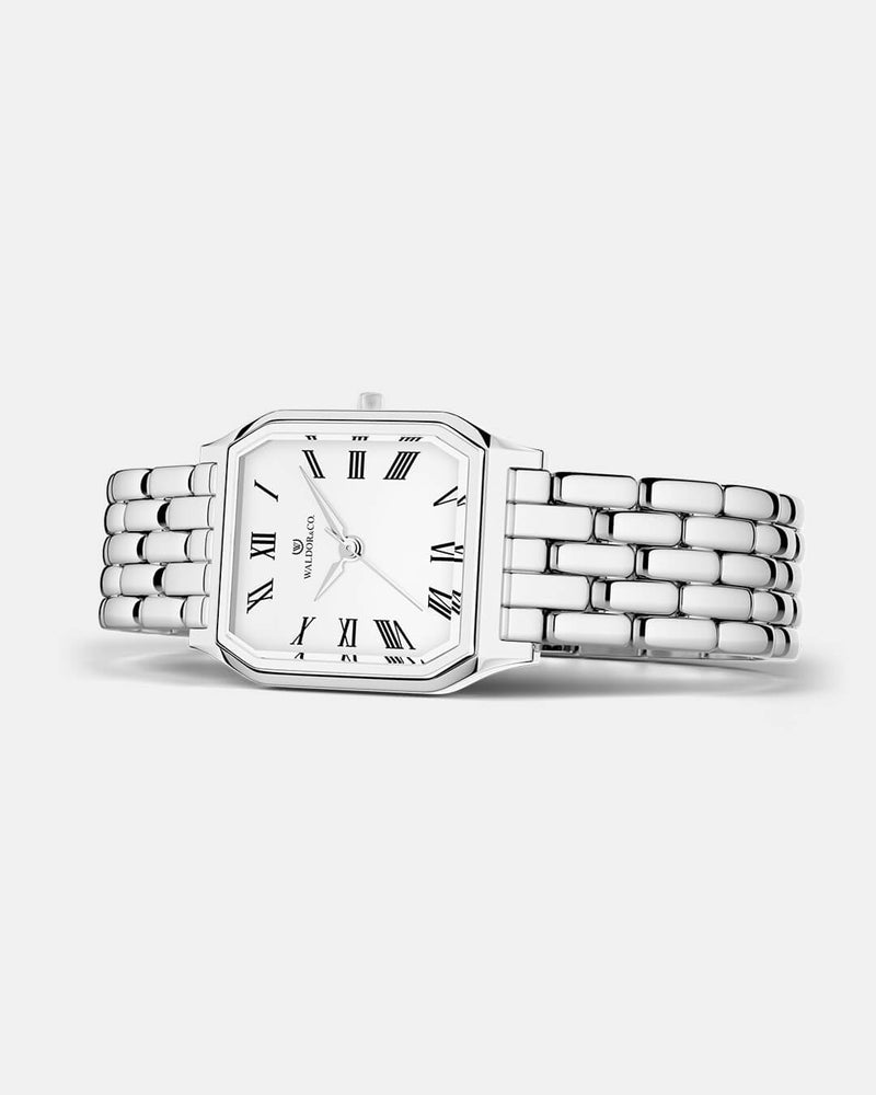 A square womens watch in Rhodium-plated 316L stainless steel from Waldor & Co. with white Diamond Cut Sapphire Crystal glass dial. Seiko movement. The model is Eternal 22 Bellagio.
