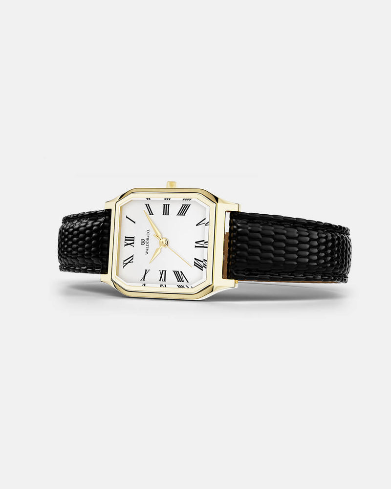 A square womens watch in 22k gold from Waldor & Co. with white Diamond Cut Sapphire Crystal glass dial. Strap in black Genuine leather. Seiko movement. The model is Eternal 22 Varenna. 