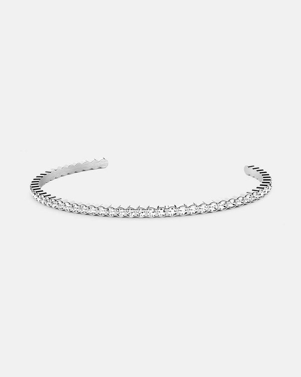 Bangle in Rhodium-plated 316L stainless steel from Waldor & Co. One size. The model is Grace Bangle Polished.