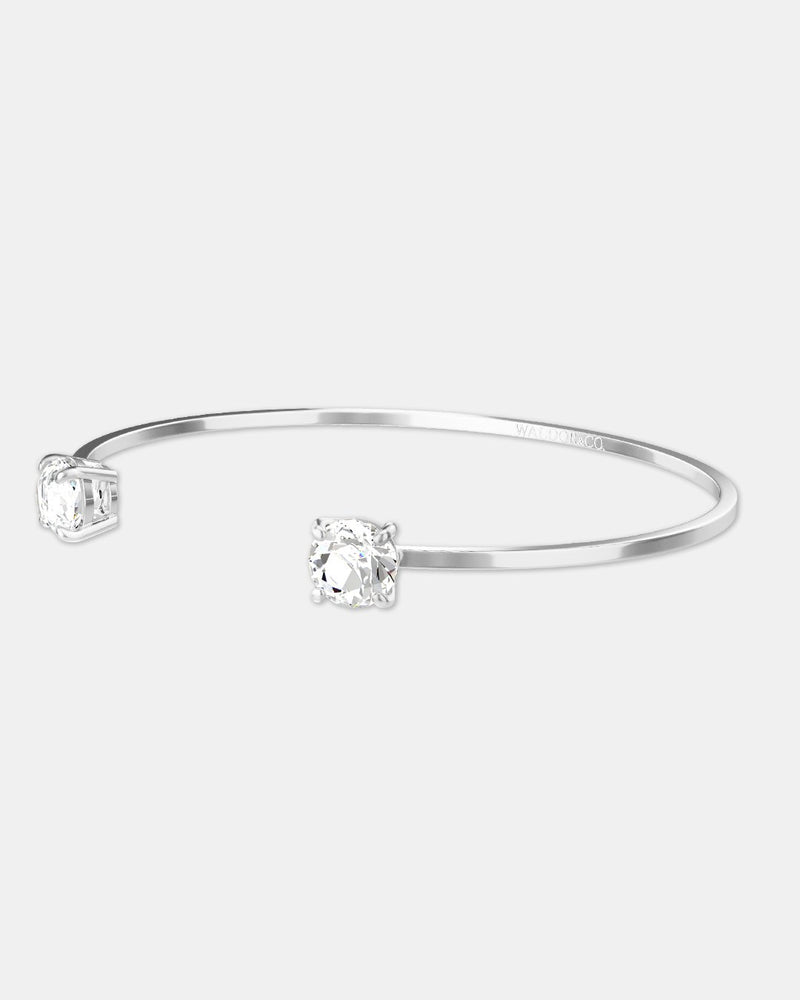 A polished stainless steel bangle in silver from Waldor & Co. One size. The model is Zircon Bangle Polished 